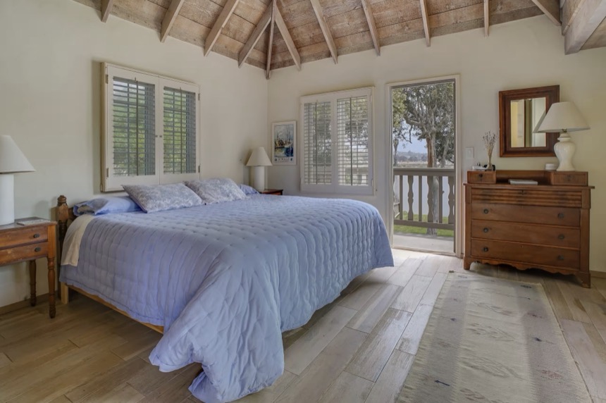 The lagoon view king bedroom, a king bed in garden light